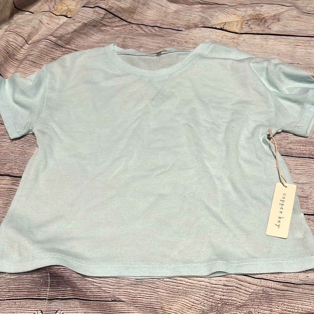 Light weight short sleeve. New with tags Blue in Color